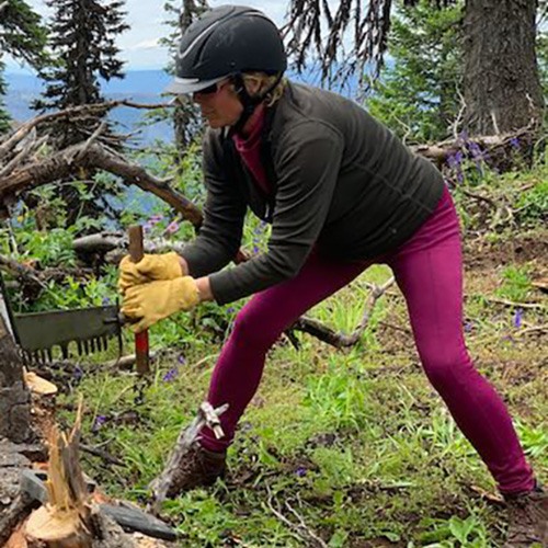 Dr. Joanna Ellington cross cutting on the ranch